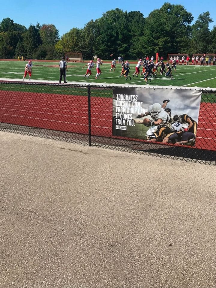 APM outdoor banner installed at a sports field
