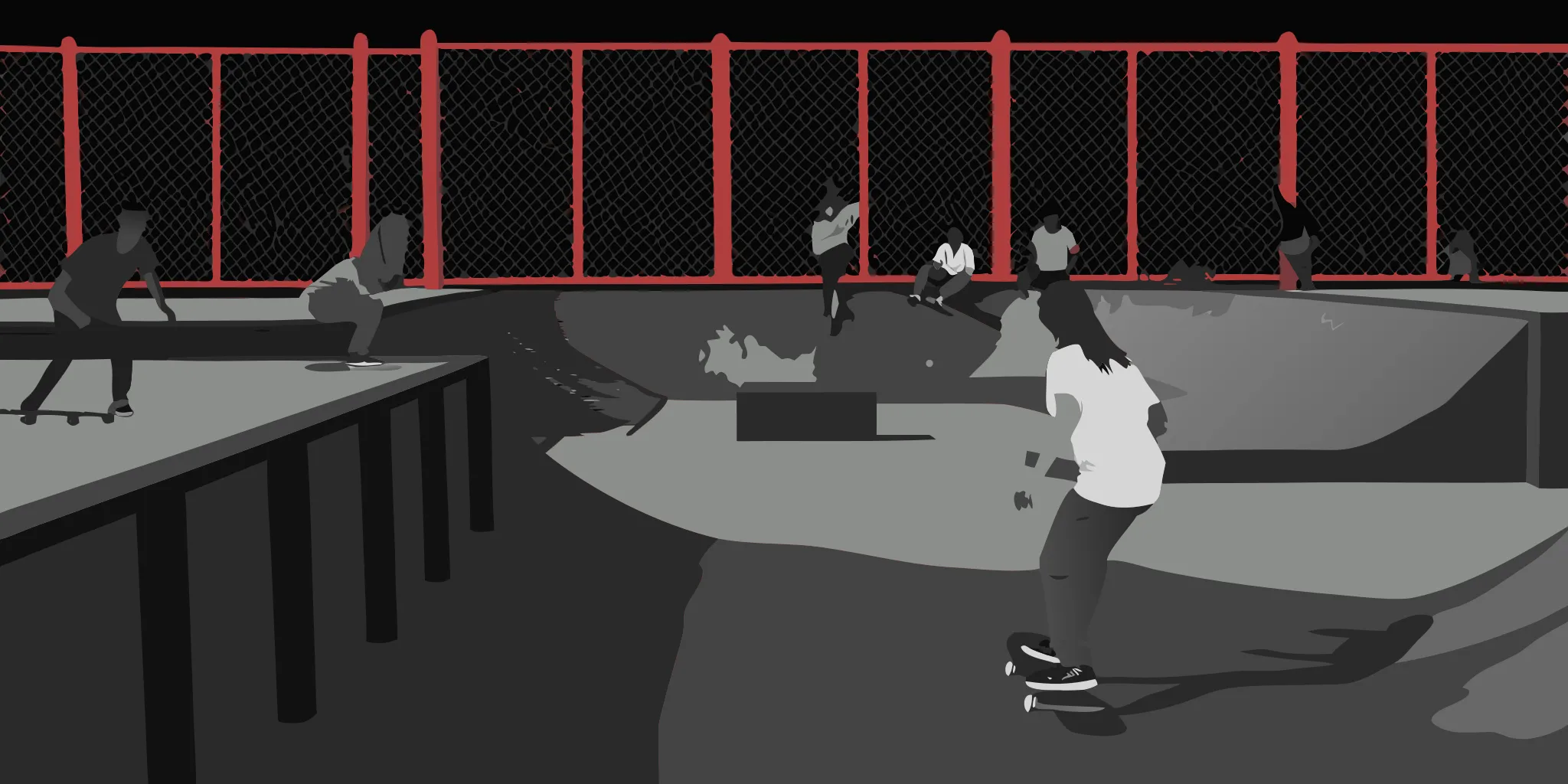 Skate park advertising panels surrounding an active outdoor skate park